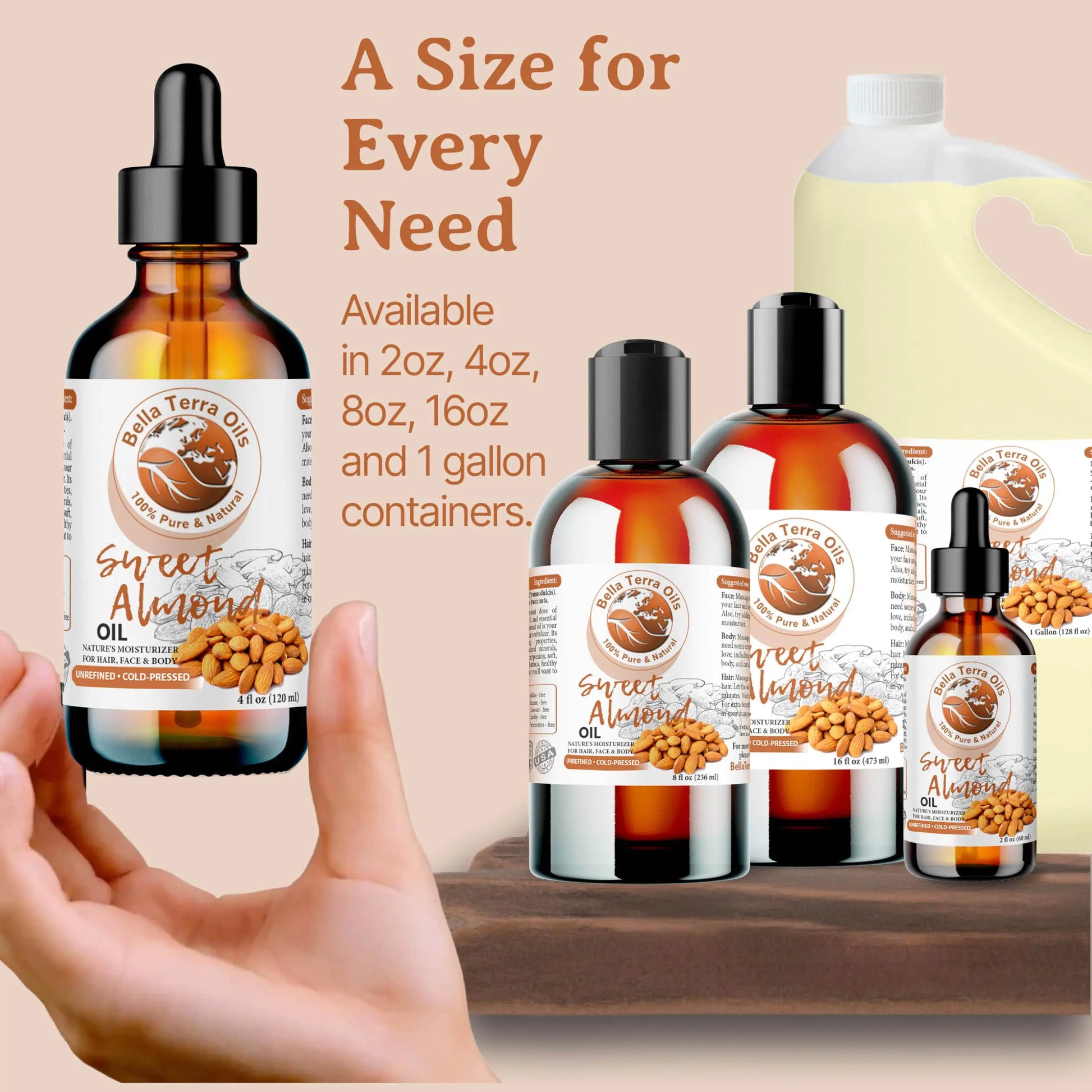 Bella Terra Organics Sweet Almond Oil bottles in various sizes with a hand holding one bottle.