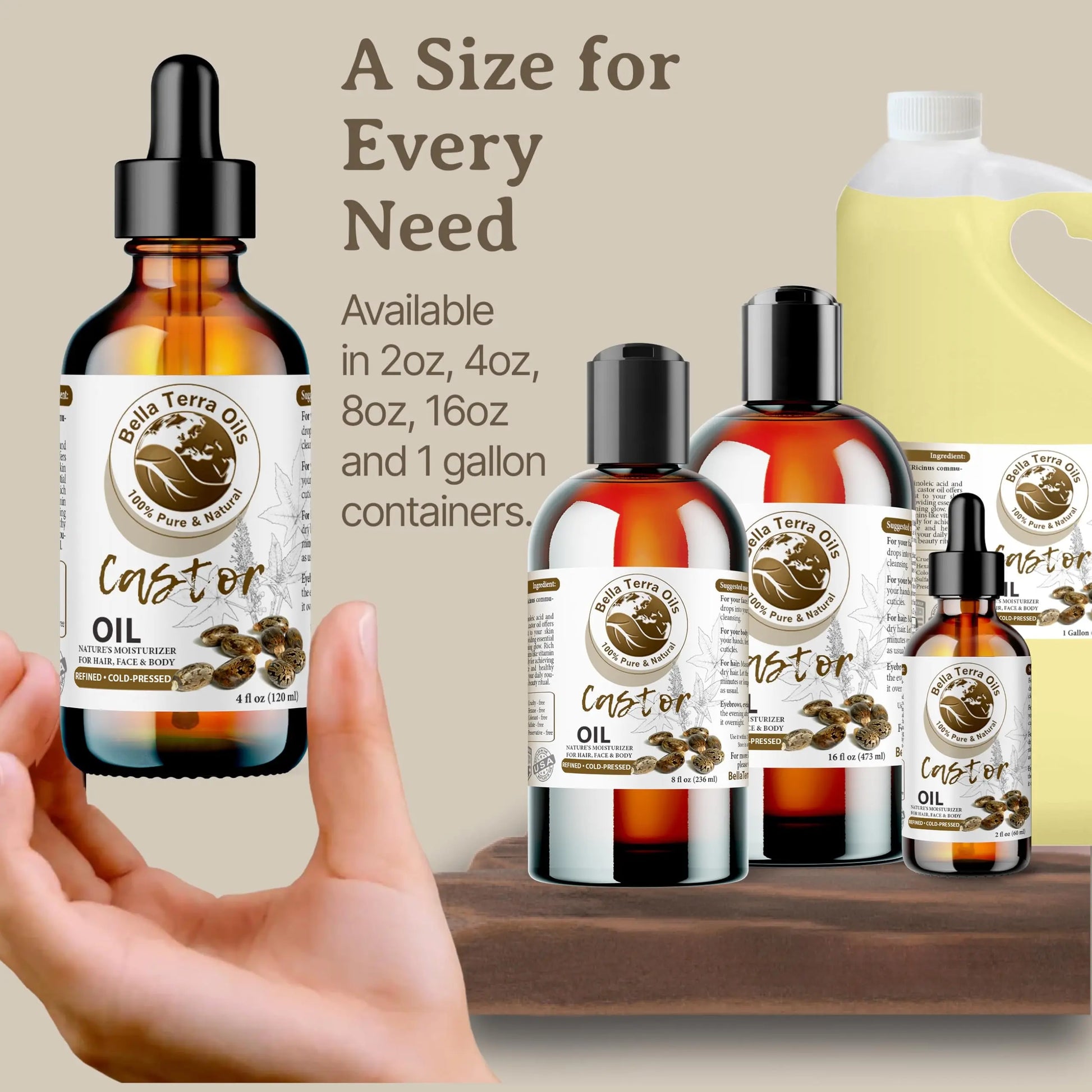 Bella Terra Organics castor oil bottles in various sizes with a hand holding one bottle.