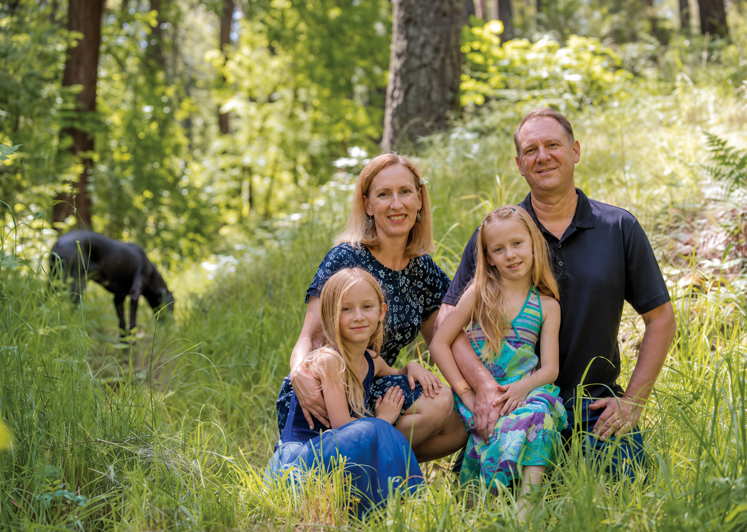 Josh and Kinga with their twin daughters Emma and Zoey in the woods near Ashland, Oregon