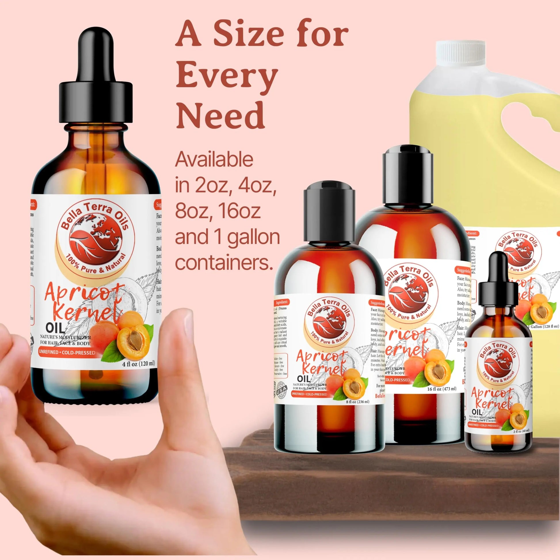 Bella Terra Apricot Kernel Oil bottles in various sizes with a hand holding one bottle.