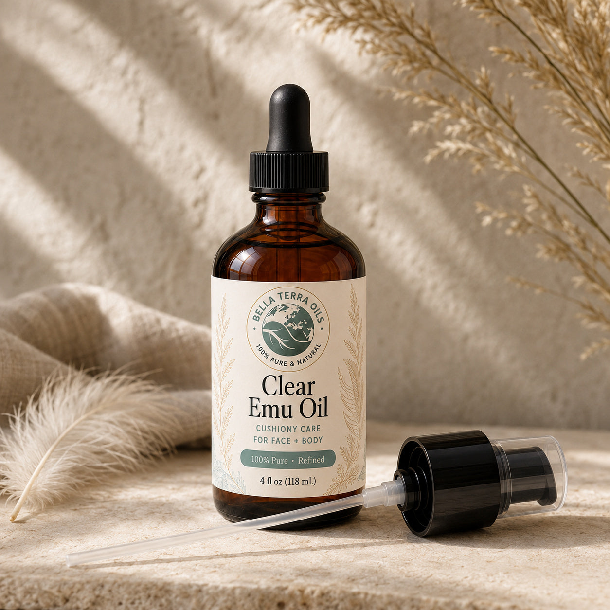 Bella Terra Clear Emu Oil 4 ounce bottle with its dropper installed and included capped pump beside it