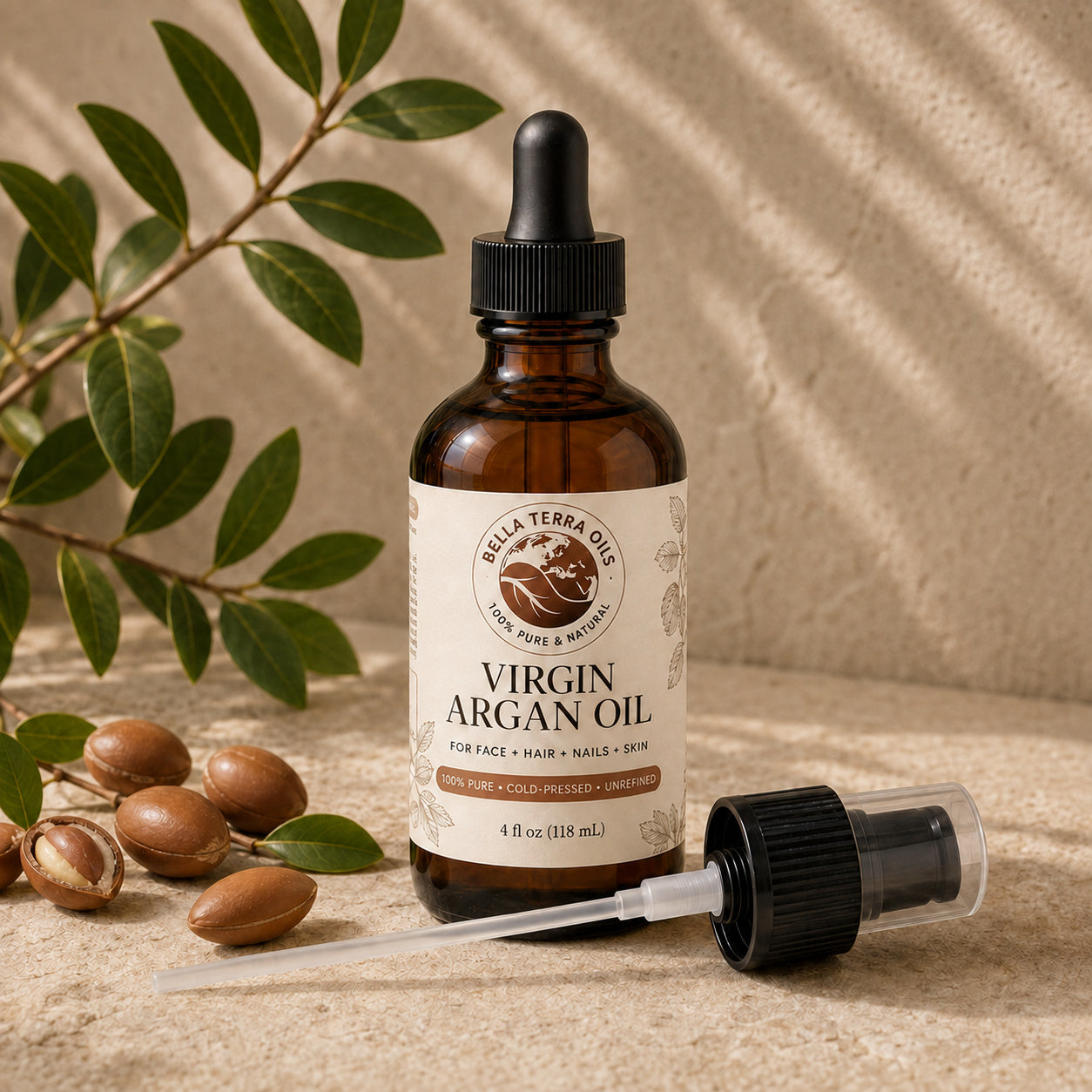 Bella Terra Argan Oil 4 ounce bottle with its dropper installed and included capped pump beside it