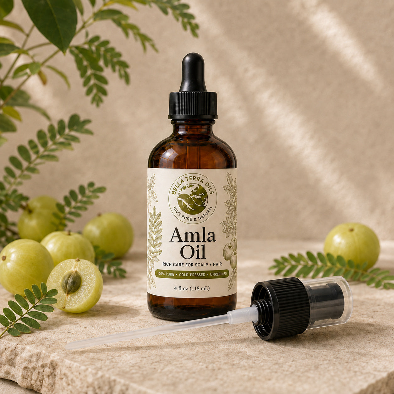 Bella Terra Amla Oil 4 ounce bottle with its dropper installed and included capped pump beside it