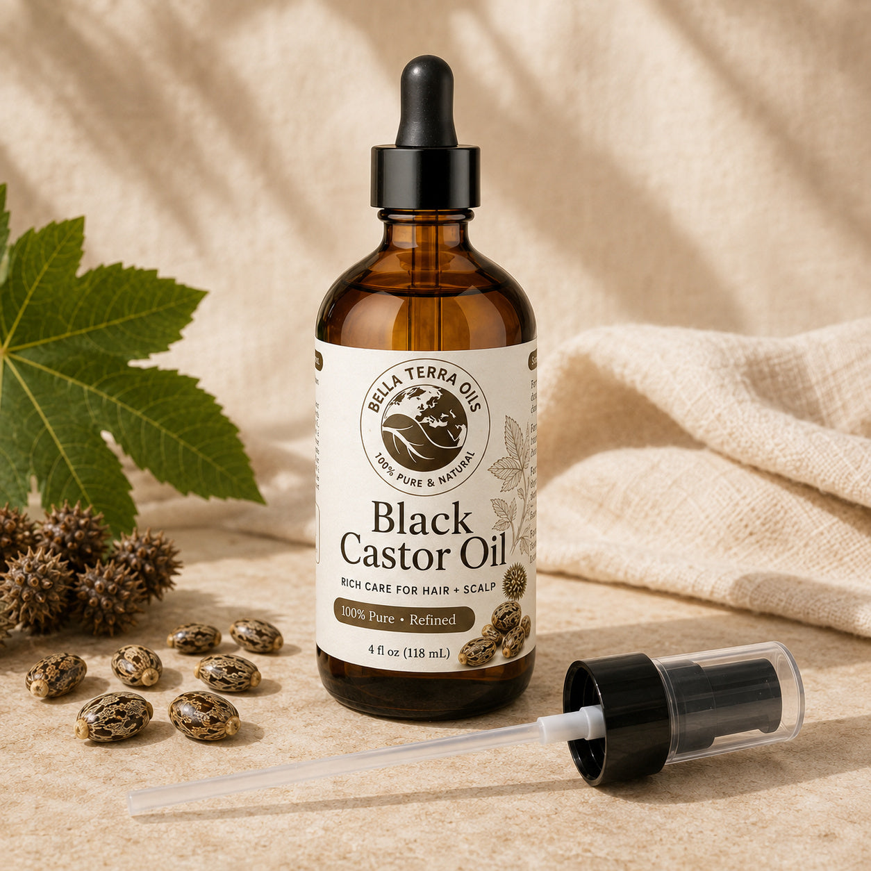Bella Terra Black Castor Oil 4 ounce bottle with its dropper installed and included capped pump beside it