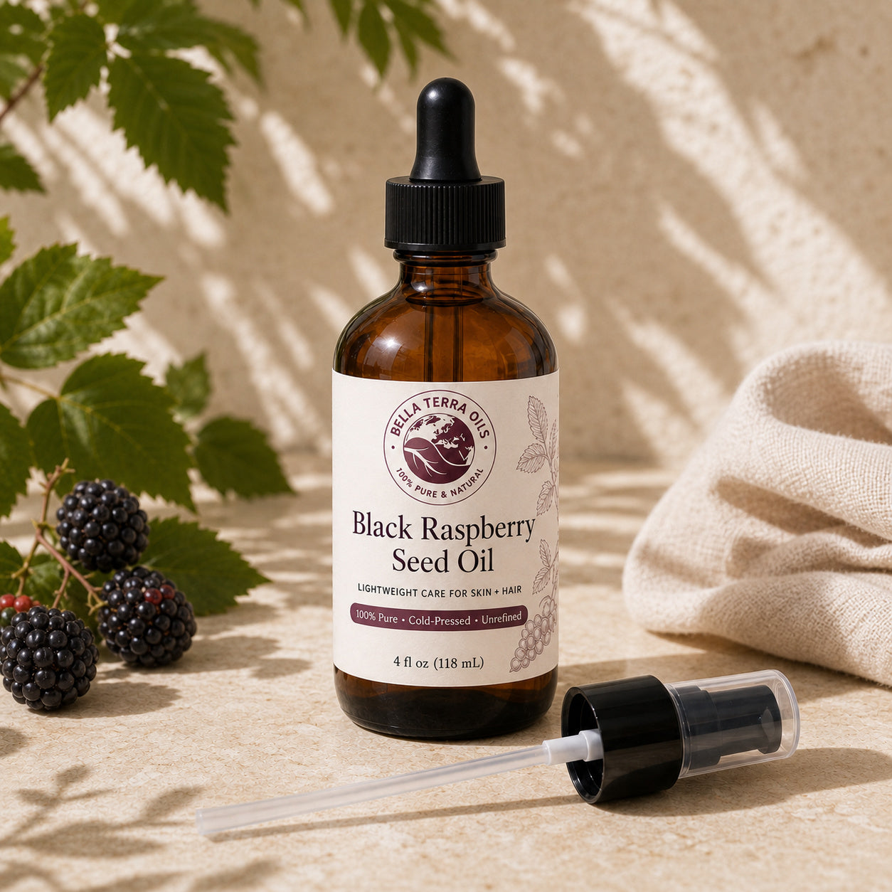 Bella Terra Black Raspberry Seed Oil 4 ounce bottle with its dropper installed and included capped pump beside it